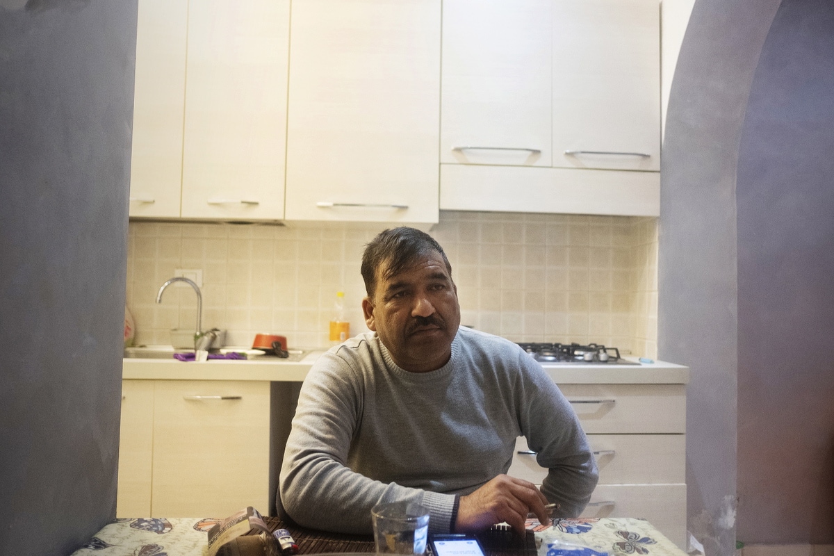 Poggio Mirteto, Oct 2019: Ilias, smoking a cigarette  in his kitchen on his return from working in the kitchen at the Gustamundo restaurant.